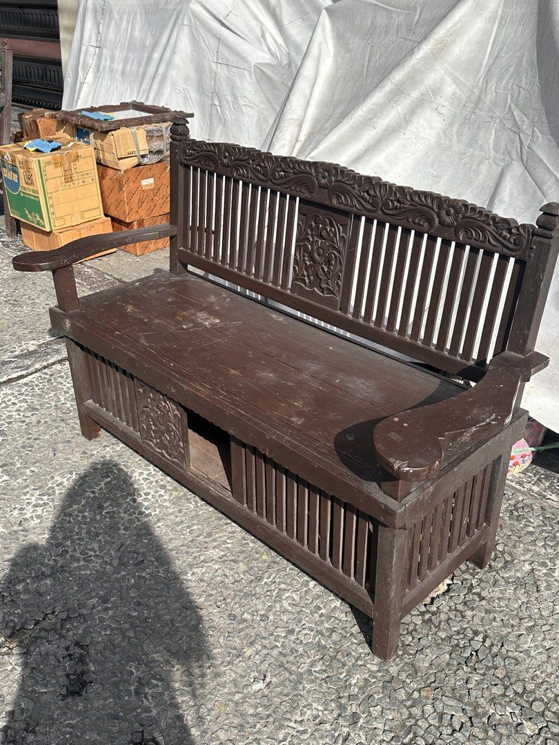 Vintage Molave Galenerra Chair (Category: Chairs) located in Quezon City. Submitted by anjherga27 (Listing ID 1447815742, Image 3). Description: - Vintage wooden bench with intricate carvings - Dark brown wood finish - Slatted seat design - Features a hidden storage compartment - Ideal for entryways or as a decorative accent piece - Sturdy construction.