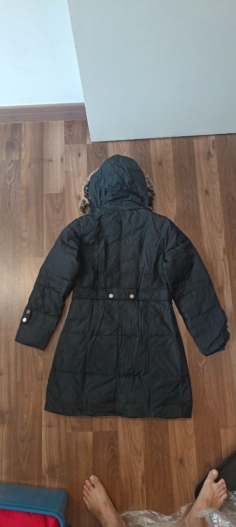 Winter Jacket ，down jacket (Category: Coats, Jackets and Outerwear) located in Kuala Lumpur. Submitted by swantansk (Listing ID 1447718650, Image 2). Description: - Black parka jacket - Hood with faux fur trim - Button and zip closure - Two front pockets with button details - Adjustable waist tie - Button details on sleeve cuffs - Ideal for cold weather.