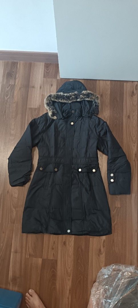 Winter Jacket ，down jacket (Category: Coats, Jackets and Outerwear) located in Kuala Lumpur. Submitted by swantansk (Listing ID 1447718650, Image 1). Description: - Black parka jacket - Hood with faux fur trim - Button and zip closure - Two front pockets with button details - Adjustable waist tie - Button details on sleeve cuffs - Ideal for cold weather.