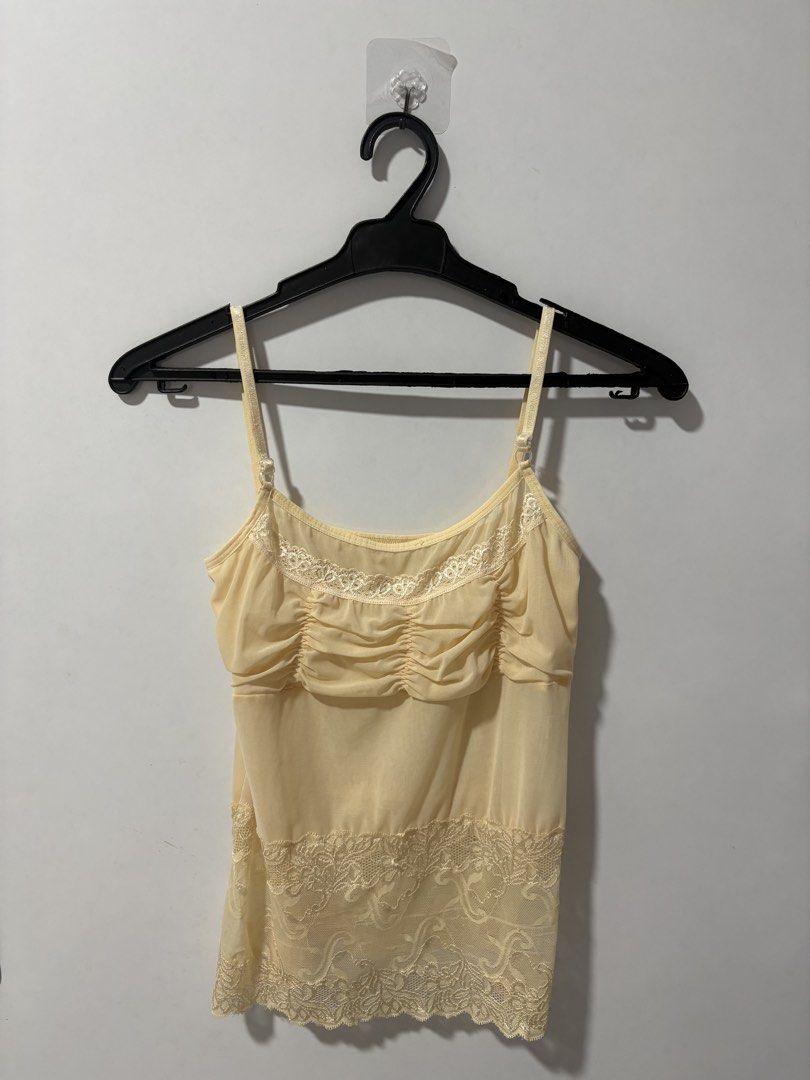 Yellow Sheer Lace Camisole Top (Category: Sleeveless) located in Pasig City. Submitted by rtd.shop (Listing ID 1447702916, Image 1). Description: - Fits XS-S frames - Has adjustable straps - Never used this MOP: Gcash, Bank Transfer MOD: Lalamove/Grab, Gogo Xpress (if outside Metro Manila) Location: Pasig DM me for more details! 😁.