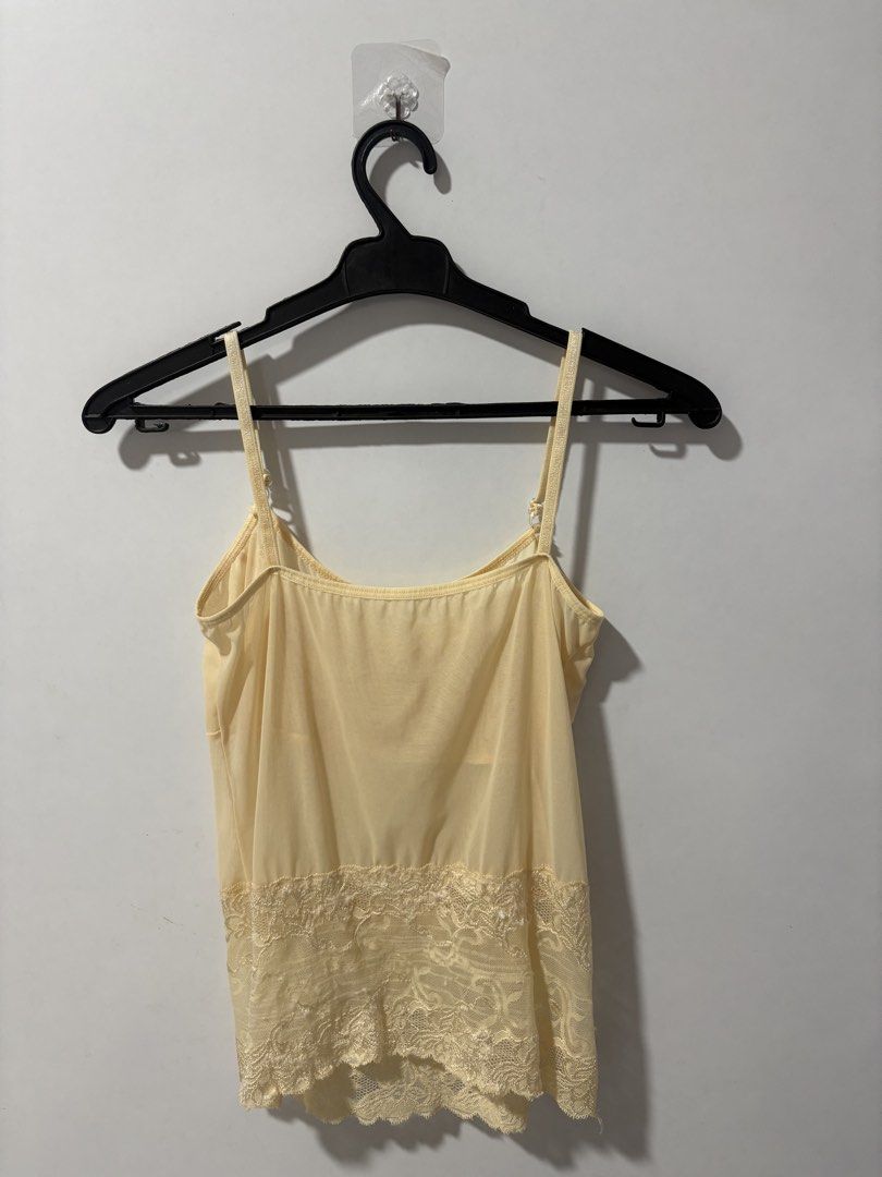 Yellow Sheer Lace Camisole Top (Category: Sleeveless) located in Pasig City. Submitted by rtd.shop (Listing ID 1447702916, Image 2). Description: - Fits XS-S frames - Has adjustable straps - Never used this MOP: Gcash, Bank Transfer MOD: Lalamove/Grab, Gogo Xpress (if outside Metro Manila) Location: Pasig DM me for more details! 😁.
