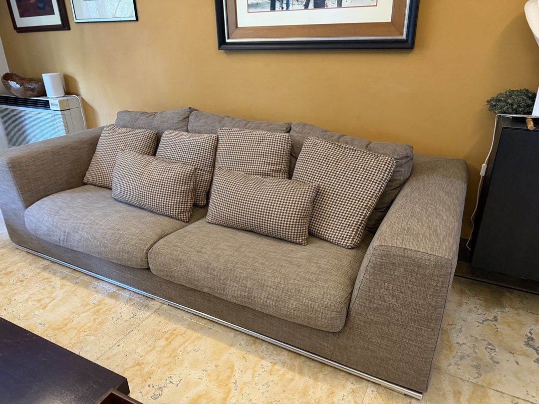 3-Seater Sofa with Cushions (Category: Sofas) located in Pasig City. Submitted by kjochua (Listing ID 1447885701, Image 2). Description: - Comfortable 3-seater sofa - Neutral beige fabric - Modern design with sleek metal base - Comes with 6 checkered throw pillows - Ideal for living rooms and lounges - Ample seating for family and friends 3 seater sofa set: Length: 234cm Depth: 105 cm Height: 60cm.