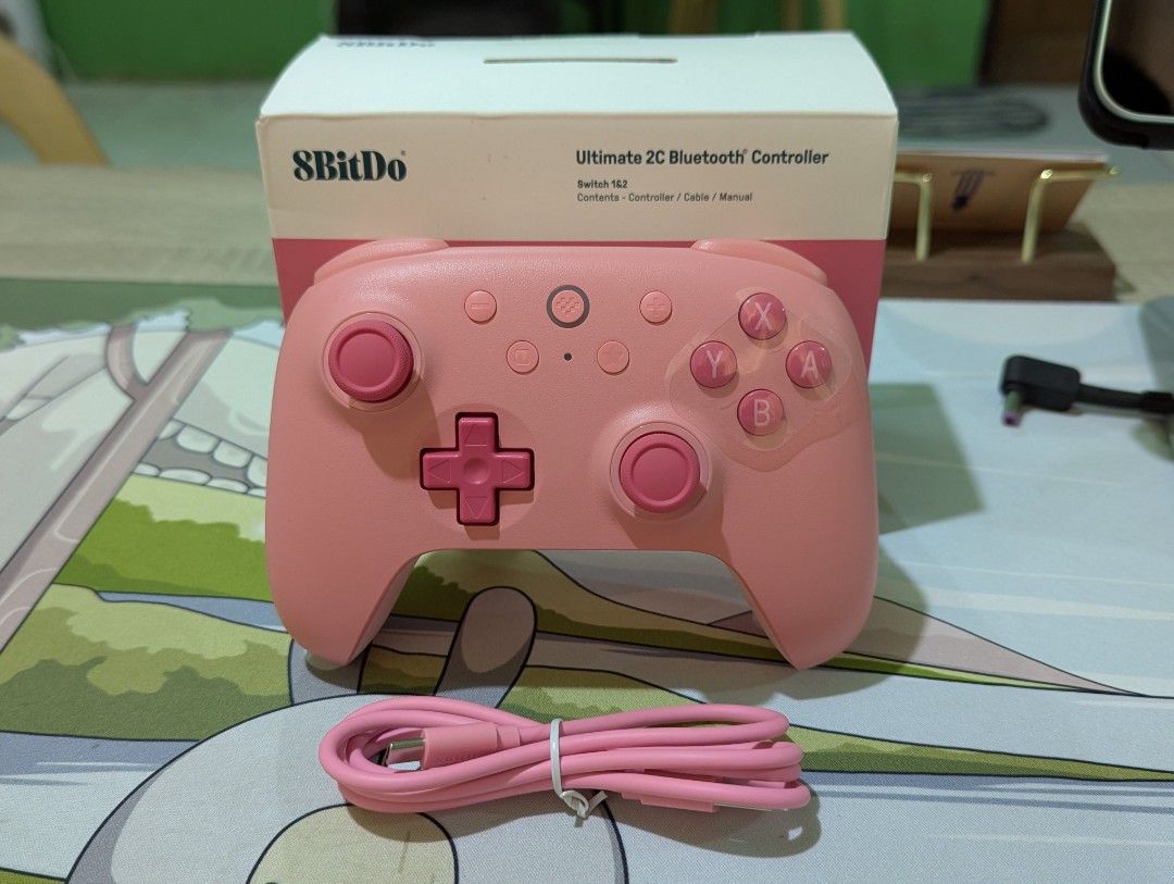8BitDo Ultimate 2C Bluetooth Controller Pink (Category: Controllers) located in Iriga City. Submitted by seigcor (Listing ID 1447931463, Image 2). Description: - Pink 8BitDo Ultimate 2C Bluetooth Controller - Compatible with Nintendo Switch and other devices - Includes: Controller, USB-C cable, manual - Original packaging intact - Tested and confirmed working - Perfect for gaming anywhere.