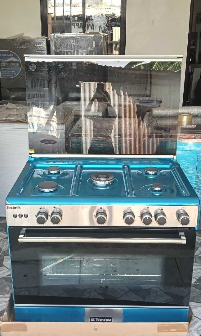 90cm Tecnogas Gas Range Big Oven (Category: Cookers) located in Caloocan City. Submitted by yam_appliances (Listing ID 1447991177, Image 1). Description: 90 cm Cooking Range 5 Gas Burners with Wok Burner Cast Iron Pan Support Sabaf / Defendi Burners Full Electric Ignition Minute Minder Full Stainless Steel Oven Features: Gas Oven / Gas Grill 3 Cooking Functions Thermostat Controlled Oven Oven Safety Valves Double Glass LOW-E Oven Door 130 L - Lar