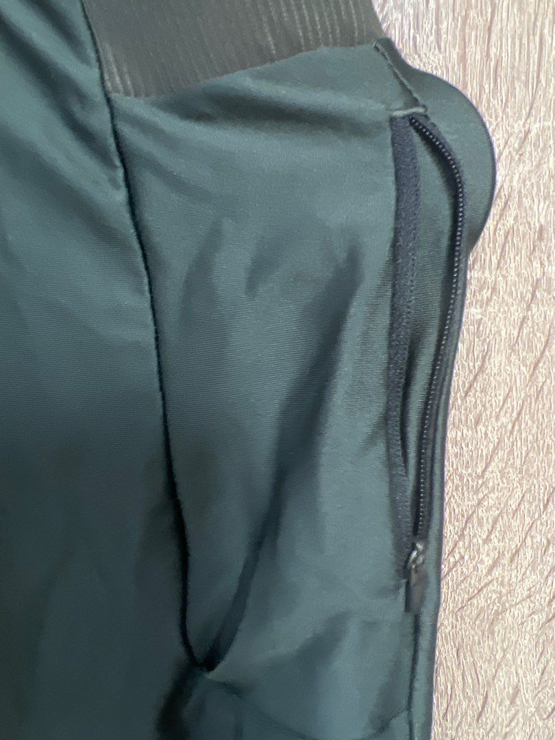Adjustable Decathlon Olive Jogger Pants (Category: Activewear) located in Paranaque City. Submitted by keithil (Listing ID 1447979089, Image 2). Description: - Dark green Kipsta pants - Size L - Elastic waistband with drawstring - Zippered side pockets - Made in Vietnam - Ideal for sports or casual wear.