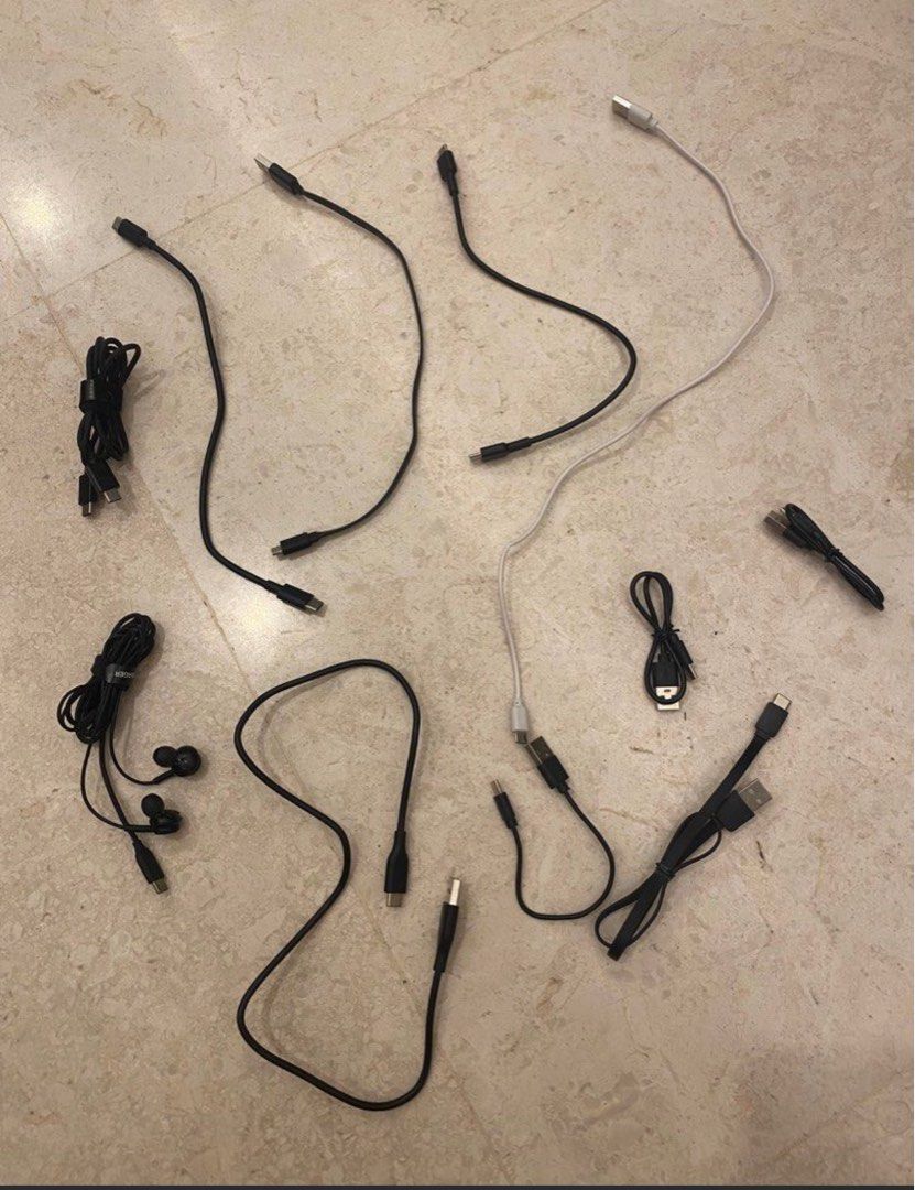 Assorted USB Cables and Black Earphones502454158979901440