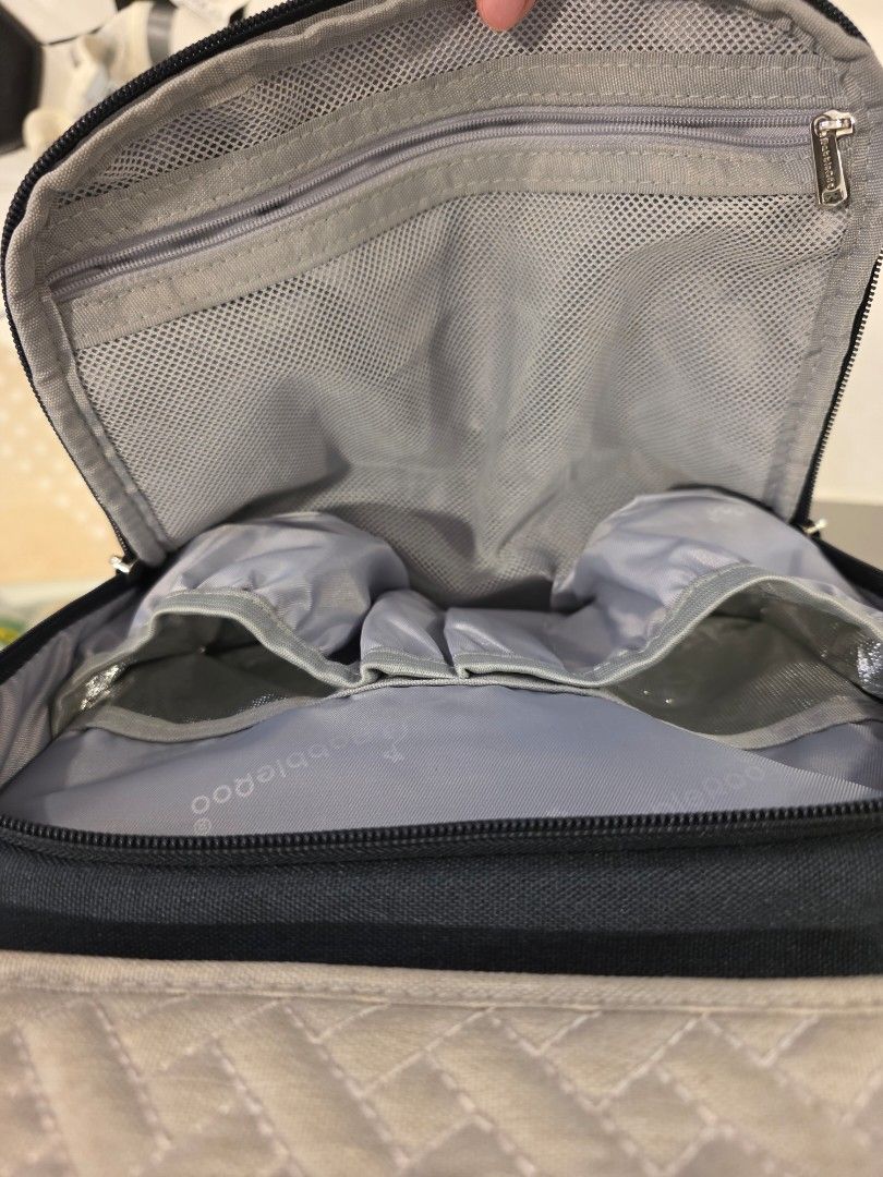 BabbleRoo Diaper Bag Backpack Navy Blue Quilted (Category: Diaper Bags & Wetbags) located in Cebu City. Submitted by gca13 (Listing ID 1447950800, Image 3). Description: - Brand: BabbleRoo - Color: Navy blue - Style: Quilted diaper bag backpack - Front pocket: Beige with textured pattern - Interior: Multiple compartments for organization - Exterior: Side mesh pocket - Zippers: Silver-toned - Perfect for carrying all your baby essentials!.