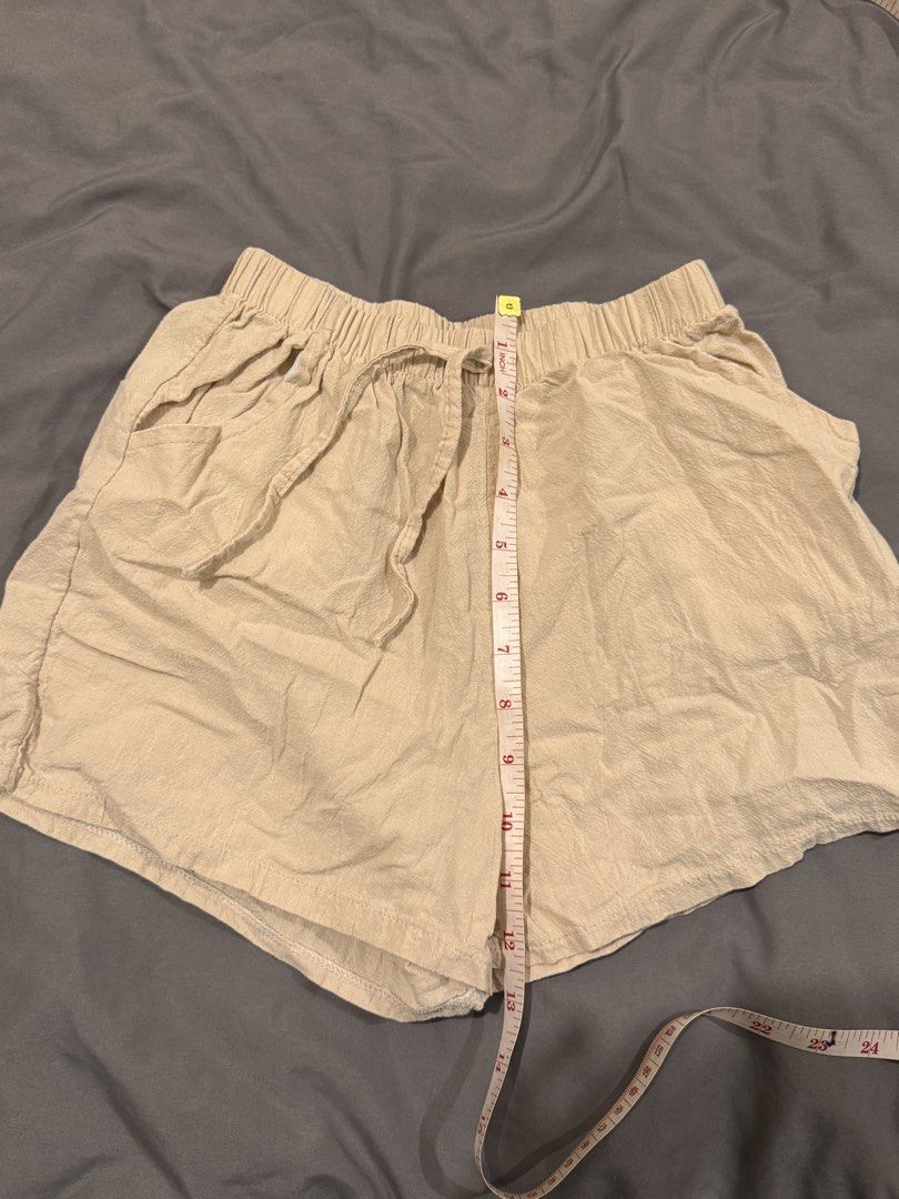Beige Linen Blend Drawstring Shorts (Category: Shorts) located in Quezon City. Submitted by ianne.declutter (Listing ID 1448003785, Image 1). Description: I think this will fit 24 waistline and BELOW This size is XS i think kahit stretchy - Comfy beige shorts - Drawstring waist for adjustable fit - Convenient front pockets - Linen-blend fabric, ideal for casual outings - Versatile: pairs easily with any top.