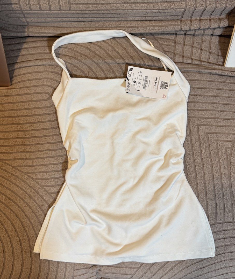bershka white classy halter neck top (Category: Blouses) located in Quezon City. Submitted by hanwardrobe (Listing ID 1448051161, Image 1). Description: -bnew w tag ₱995 -size small (can fit up to xs).