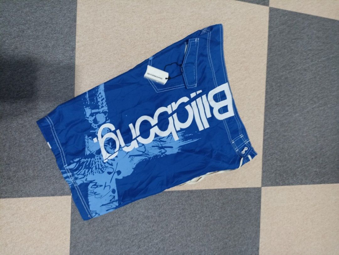 Billabong Blue Board Shorts Size 36 (Category: Swim Trunks & Board Shorts) located in Marawi City. Submitted by abdullah0692139 (Listing ID 1448037644, Image 2). Description: - Blue Billabong board shorts - Size 36 - Features graphic print and Billabong logo - Made with factory stretch material - Comes with comb tag - Ideal for swimming or surfing.