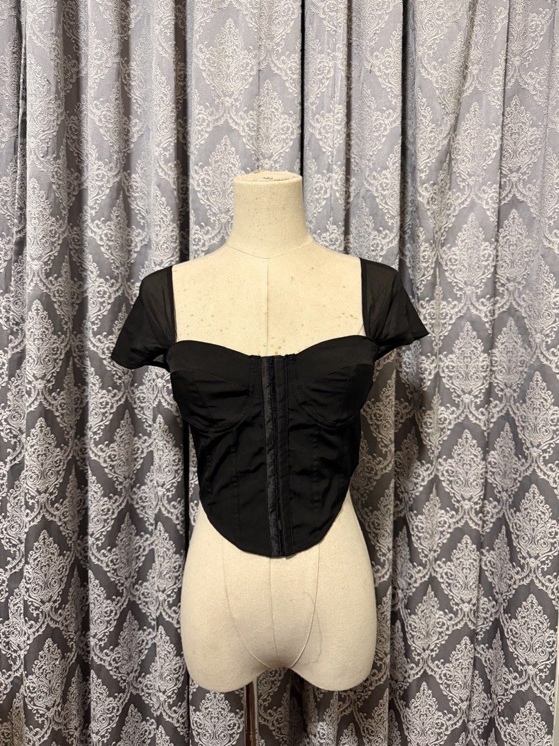 Black Corset Top with Sheer Cap Sleeves (Category: Others Tops) located in Iloilo. Submitted by happywhale_bf81c9 (Listing ID 1447947935, Image 1). Description: - Black corset top - Sweetheart neckline - Front hook and eye closure - Sheer, fluttery cap sleeves - Cropped length - Ideal for night outs or special occasions.