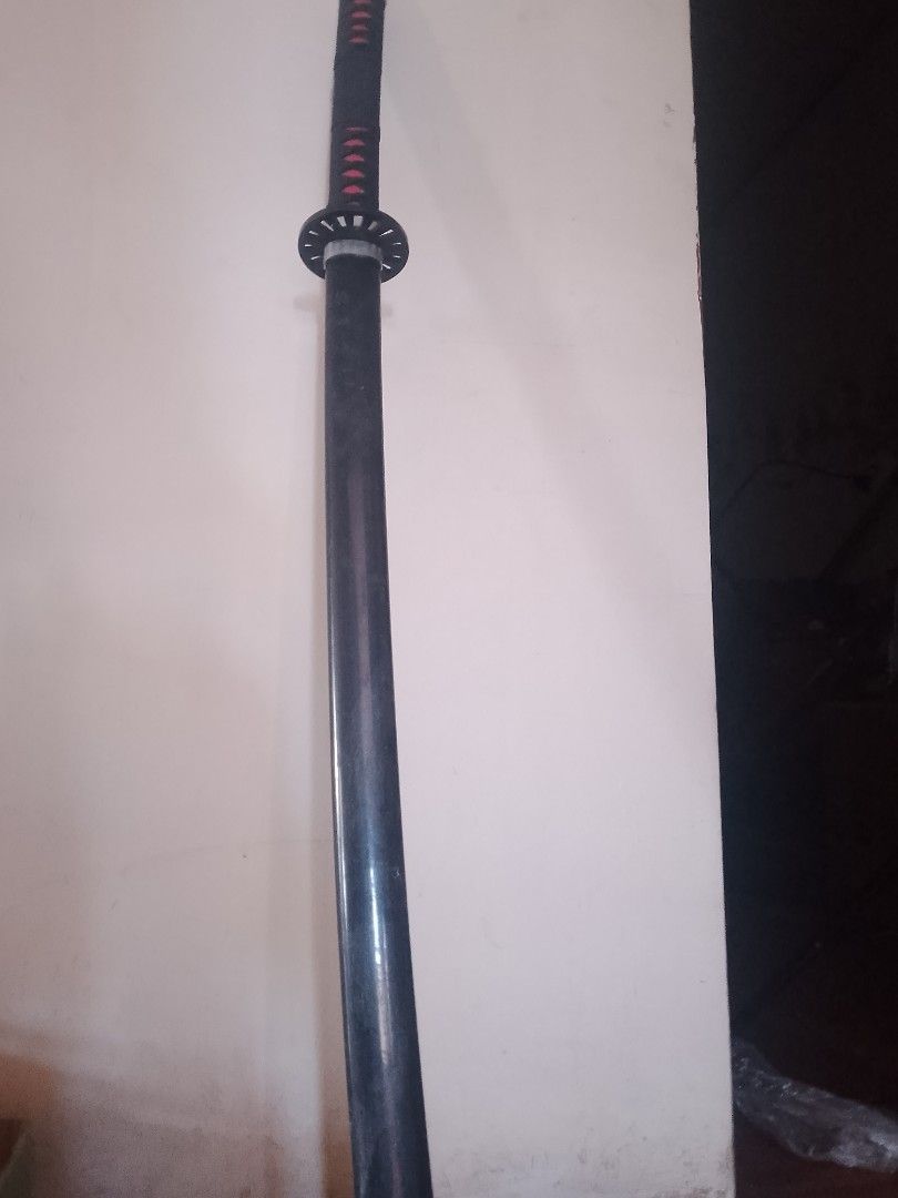 Black Katana Sword for cosplay (Category: Vintage Collectibles) located in Calamba. Submitted by felix_man1313 (Listing ID 1447926384, Image 2). Description: RFS: college tuition Black katana sword with red diamond handle wrap and silver accents. Full length, perfect for display or cosplay..