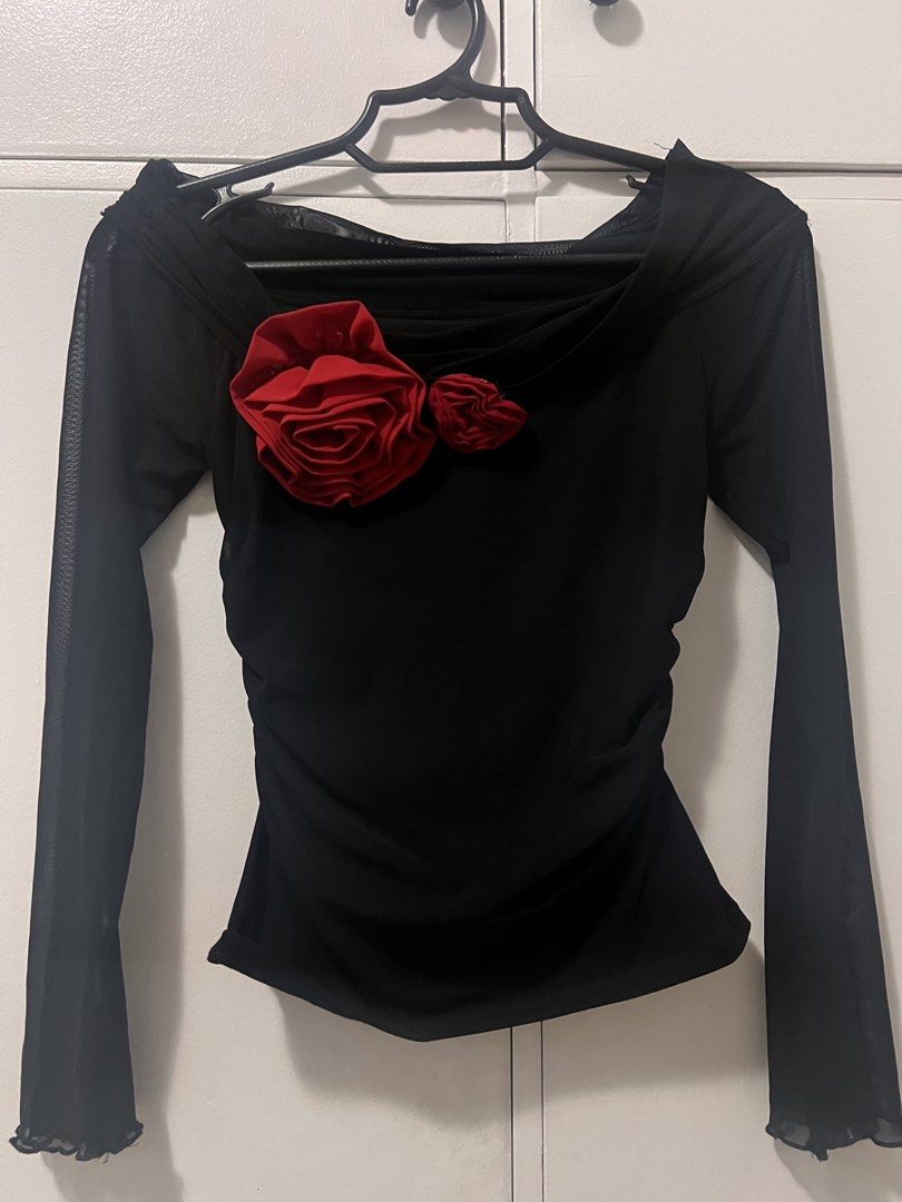 Black Mesh Top with Red Rose Embellishments (Category: Blouses) located in Makati City. Submitted by g.ang.s (Listing ID 1447927841, Image 2). Description: - Long-sleeved black mesh top - Draped neckline with ruched detailing - Two red fabric roses on the chest - Sheer sleeves with ruffled hem - Unique and eye-catching design.