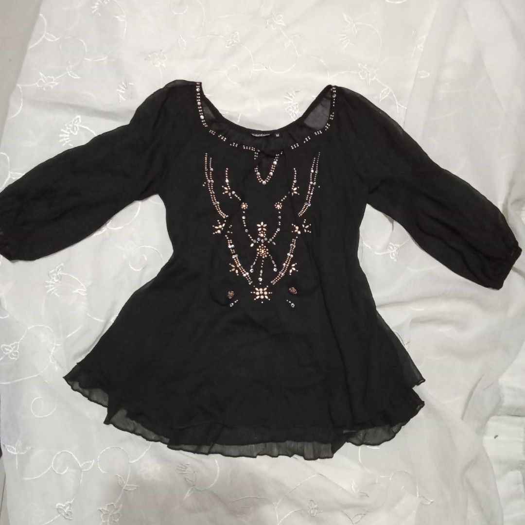 Black Sheer Blouse with Embellishments (Category: Blouses) located in Talisay. Submitted by peonisces (Listing ID 1448009943, Image 1). Description: size small to semi med flaw some embellishments missing - Sheer black fabric - Long sleeves - Intricate bead and sequin embellishments on the front - Scoop neck with tie detail - Lightweight and flowy material - Versatile for layering or dressing up - Pairs well with jeans or skirts.