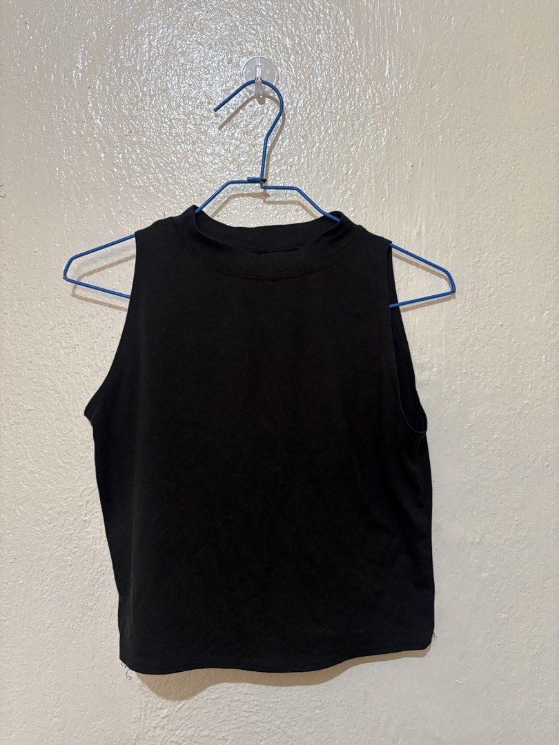 Black Sleeveless Mock Neck Crop Top (Category: Sleeveless) located in Quezon City. Submitted by agxtha (Listing ID 1447922805, Image 1). Description: - Black sleeveless crop top - Mock neck design - Versatile for dressing up or down - Ideal for layering or wearing on its own - Effortlessly matches any bottoms 📍 Meet-up (Around Metro Manila) or shipping available 💸 Negotiable • Open to offers - feel free to chat!.