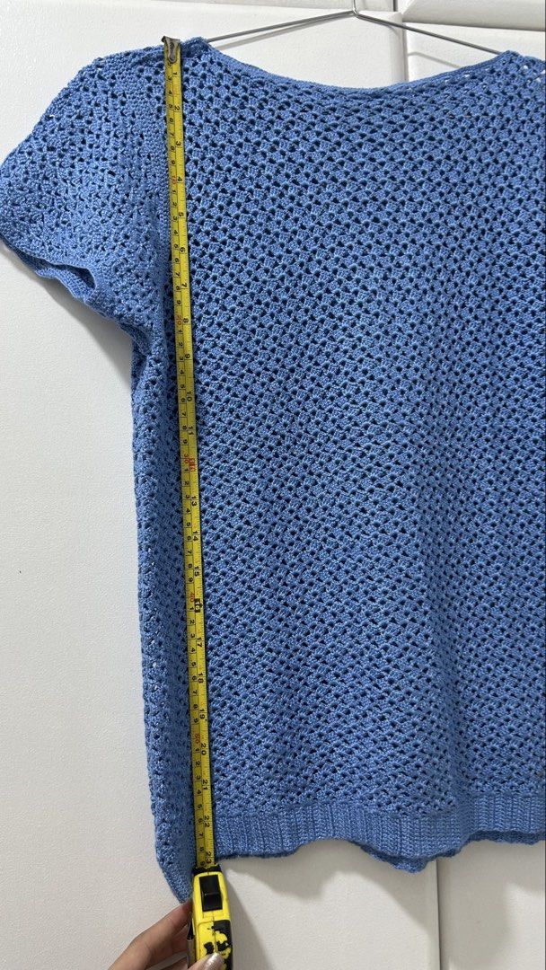 Blue Crochet Short Sleeve Top (Category: Blouses) located in San Fernando. Submitted by TheBTBs (Listing ID 1447948218, Image 3). Description: - Light blue crochet top - Short sleeves -handmade - Open knit pattern - Ribbed hem - Versatile: great for layering or wearing on its own - Approx. Measurements: 22 inches length, 18 inches chest width ⚠️ Reminder Color may appear slightly different in photos due to lighting and screen settings. No return 