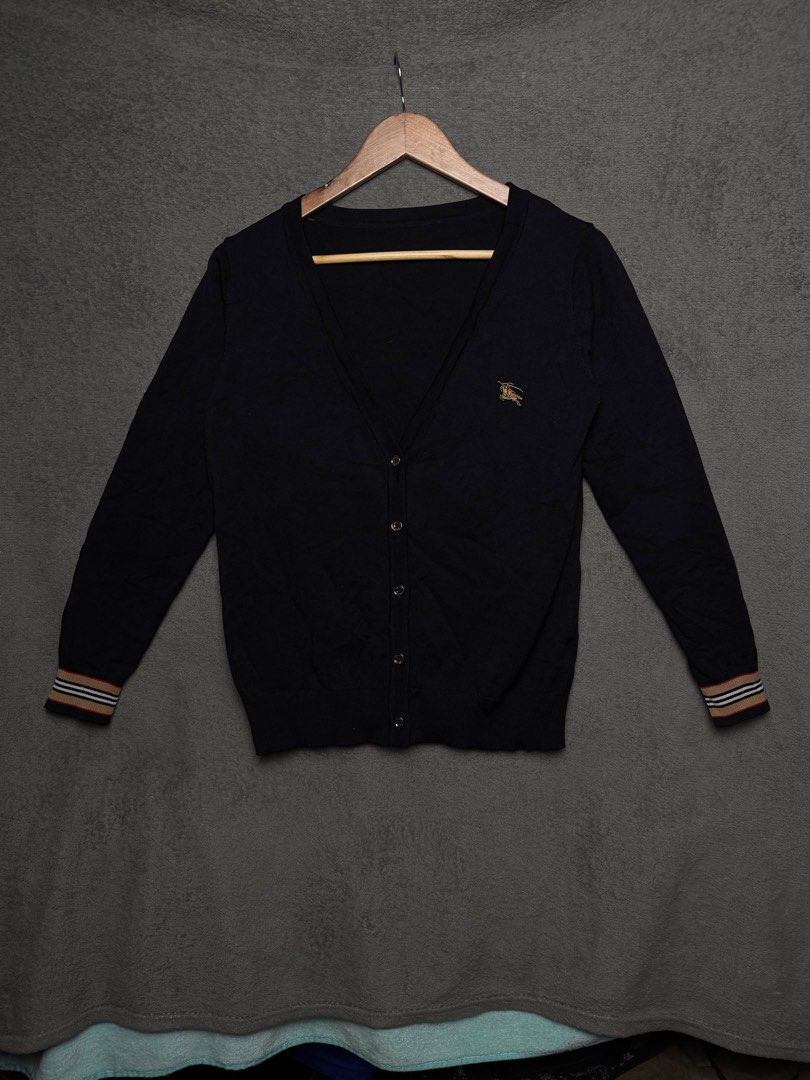 Burberry cardigan (Category: Longsleeves) located in Taguig. Submitted by thasmallph (Listing ID 1448016833, Image 1). Description: Authentic legit Excellent condition No issue Size medium Dimes Width 21 Length 27.