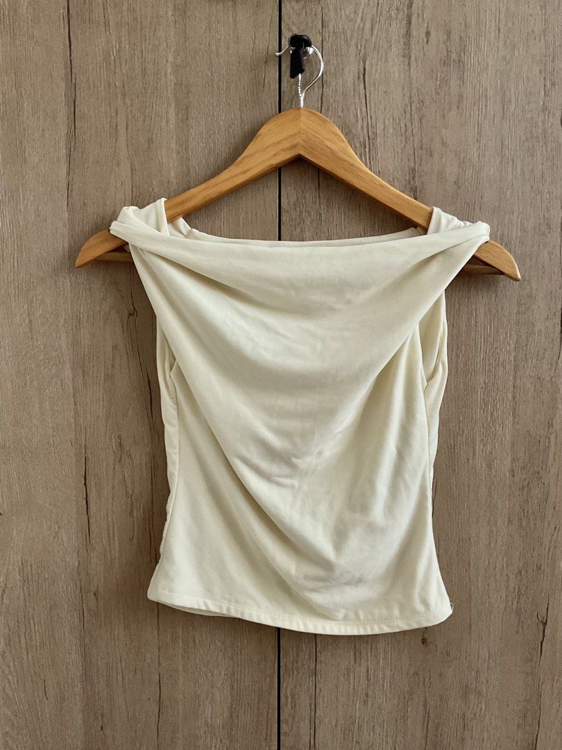 Butter Yellow/ Cream Drape Neck Sleeveless Top (Category: Sleeveless) located in Kalibo. Submitted by 97blnk (Listing ID 1447942813, Image 1). Description: - Cream sleeveless top - Draped neckline - Soft fabric - Very flattering fit - Versatile: perfect for night out or casual wear - Easy to style with jeans or skirts.