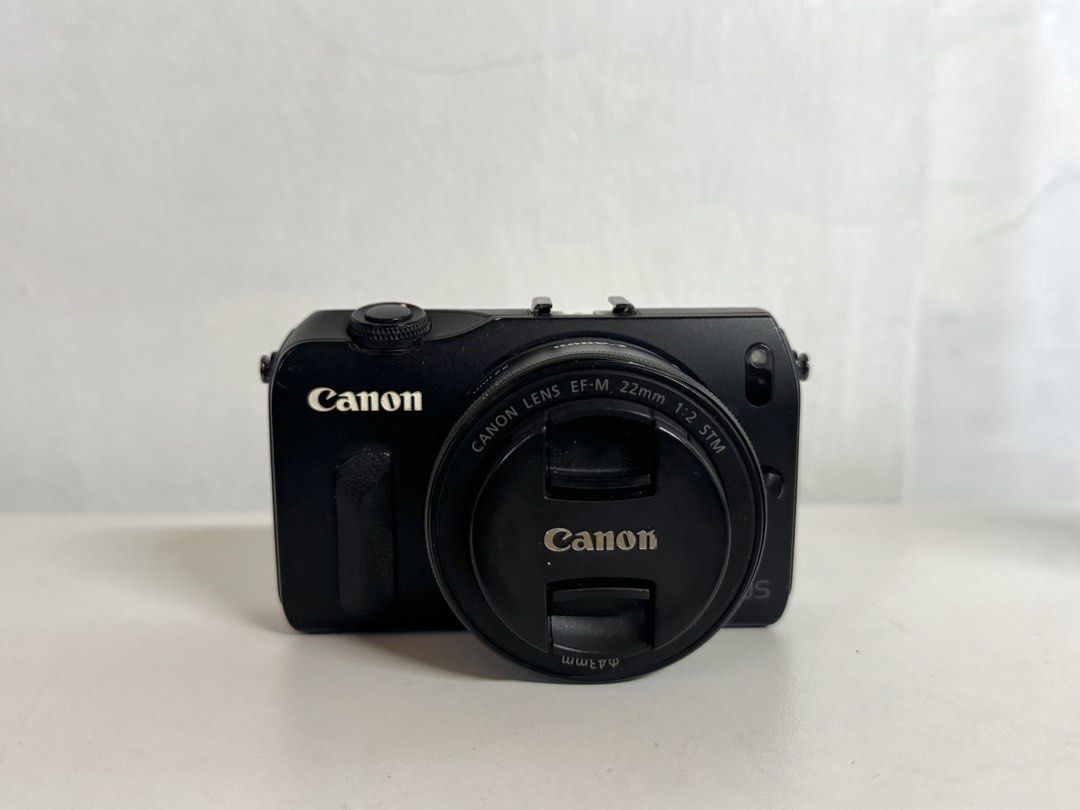 Canon EOS M Mirrorless Camera (Category: Cameras) located in Taguig. Submitted by kgilliann (Listing ID 1447891705, Image 1). Description: Canon EOS M Mirrorless Camera - 18 MP APS-C sensor - Canon EF-M lens mount - 3.0-inch touchscreen LCD - 8/10 body cosmetics - Fully functional Inclusions: - 22 mm lens (kit lens) and 18-55 mm lens - 4 GB memory card - Screen protector (although may scratches na rin 'yung protector) - Original battery + extra b