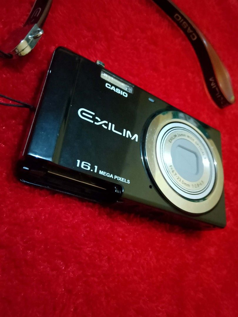 Casio Exilim Preloved DigiCam (Category: Cameras) located in Rizal. Submitted by bonitotuna (Listing ID 1448075042, Image 2). Description: Casio Exilim Preloved DigiCam Description: 16.1 megapixels. Wide optical 5x, f=4.7-23.5mm. Strong flash and has multiple color filters. All buttons are easy to press. All internal and external features are functioning. Cover for SD card and battery is missing/broken. SD card and battery still has lock. Has scr