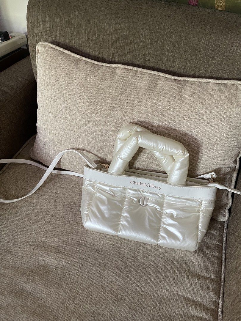 Charlotte Tilbury Puffer Bag White (Category: Luxury Bags & Wallets) located in Davao. Submitted by julyanna522 (Listing ID 1447916217, Image 1). Description: - Brand new - With detachable sling - Bought from beautyhub.dvo - RFS: Decluttering Slightly negotiable for sure buyers 😊 .