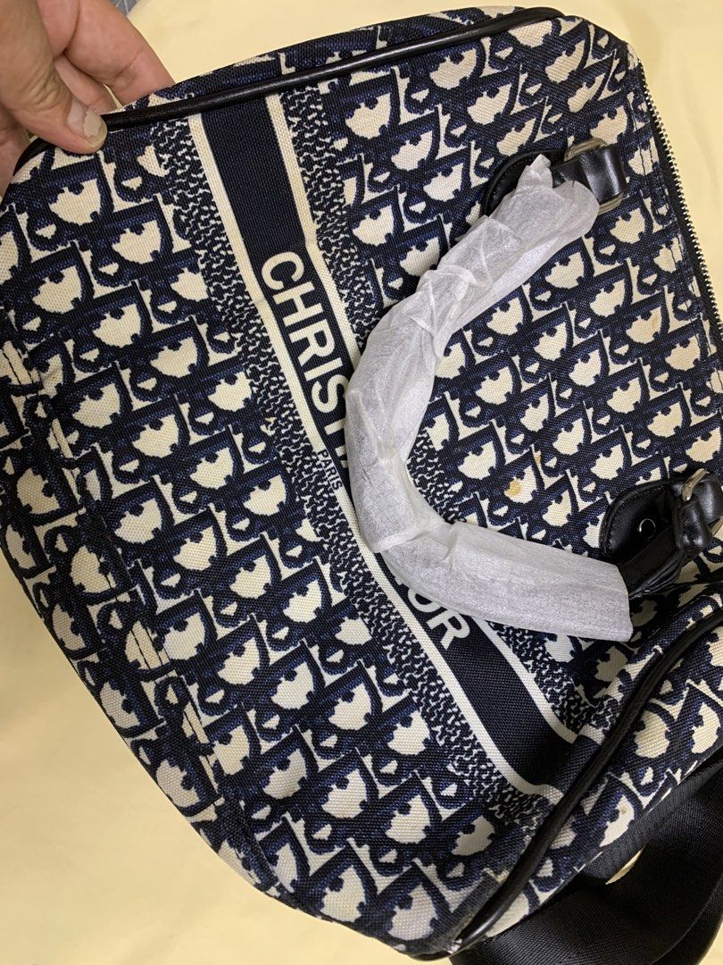 Christian Dior Oblique Canvas Sling Bag (Category: Luxury Bags & Wallets) located in Bulacan. Submitted by heartlove_holb (Listing ID 1448008849, Image 2). Description: Classic Dior Oblique canvas sling bag. Features the iconic all-over logo print. Adjustable strap for comfortable wear. Interior has a zippered pocket and slip pockets. Some minor marks on the canvas, as pictured. Great for everyday use..