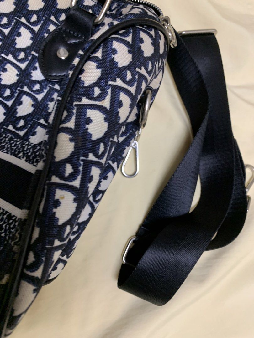 Christian Dior Oblique Canvas Sling Bag (Category: Luxury Bags & Wallets) located in Bulacan. Submitted by heartlove_holb (Listing ID 1448008849, Image 3). Description: Classic Dior Oblique canvas sling bag. Features the iconic all-over logo print. Adjustable strap for comfortable wear. Interior has a zippered pocket and slip pockets. Some minor marks on the canvas, as pictured. Great for everyday use..