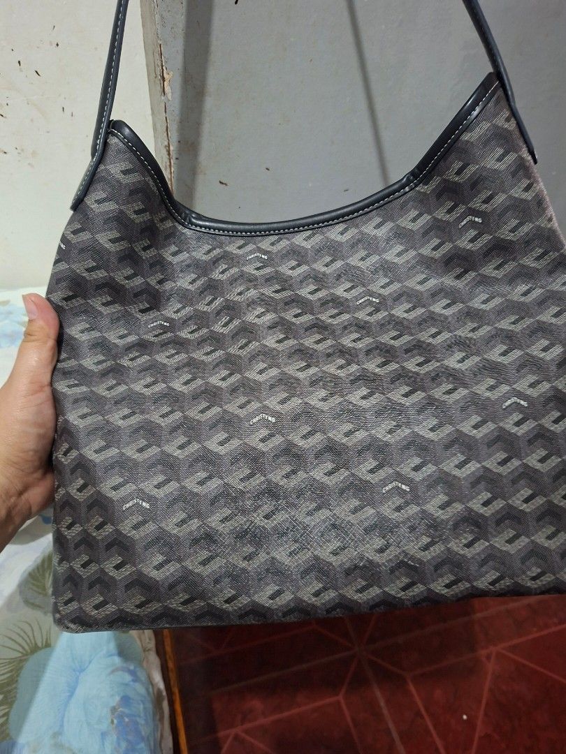Christy Ng Monogram Shoulder Bag (Category: Luxury Bags & Wallets) located in Imus. Submitted by graceannes06899 (Listing ID 1447981369, Image 2). Description: - Christy Ng monogram shoulder bag - Dark grey and black pattern - Leather trim and handles - Interior: 1 zippered pocket, 1 snap closure pocket - Flat base for stability - Ideal size for everyday carry.