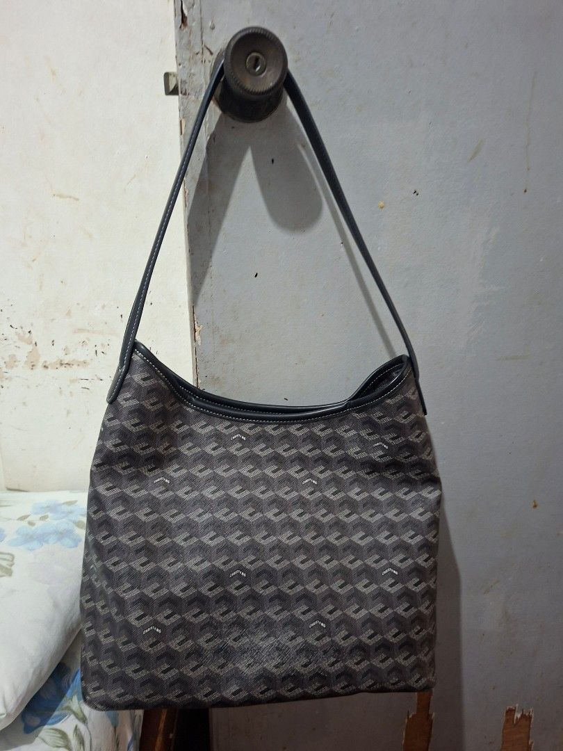 Christy Ng Monogram Shoulder Bag (Category: Luxury Bags & Wallets) located in Imus. Submitted by graceannes06899 (Listing ID 1447981369, Image 1). Description: - Christy Ng monogram shoulder bag - Dark grey and black pattern - Leather trim and handles - Interior: 1 zippered pocket, 1 snap closure pocket - Flat base for stability - Ideal size for everyday carry.
