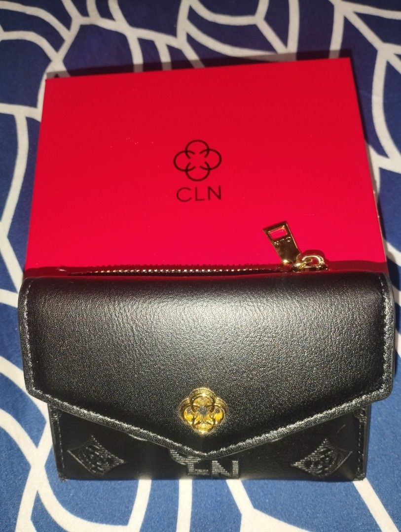 CLN Black Embossed Wallet with Box (Category: Wallets & Card holders) located in Quezon City. Submitted by tiarahdelvs (Listing ID 1448050307, Image 2). Description: - Sleek black CLN wallet - Features an elegant embossed pattern - Comes with its original red box & dust bag - Compact size, ideal for carrying essentials - Secure zipper closure on one side Message me for more pictures & video MOP: Gcash or Maribank.