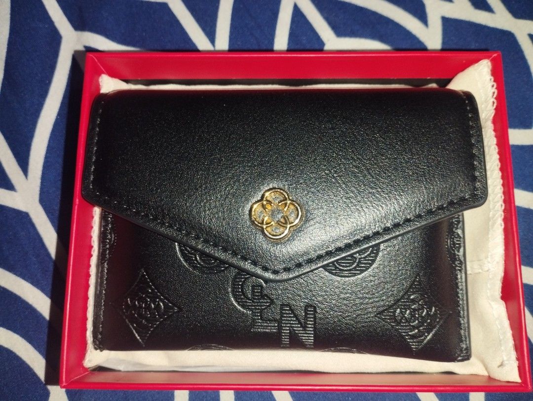 CLN Black Embossed Wallet with Box (Category: Wallets & Card holders) located in Quezon City. Submitted by tiarahdelvs (Listing ID 1448050307, Image 1). Description: - Sleek black CLN wallet - Features an elegant embossed pattern - Comes with its original red box & dust bag - Compact size, ideal for carrying essentials - Secure zipper closure on one side Message me for more pictures & video MOP: Gcash or Maribank.