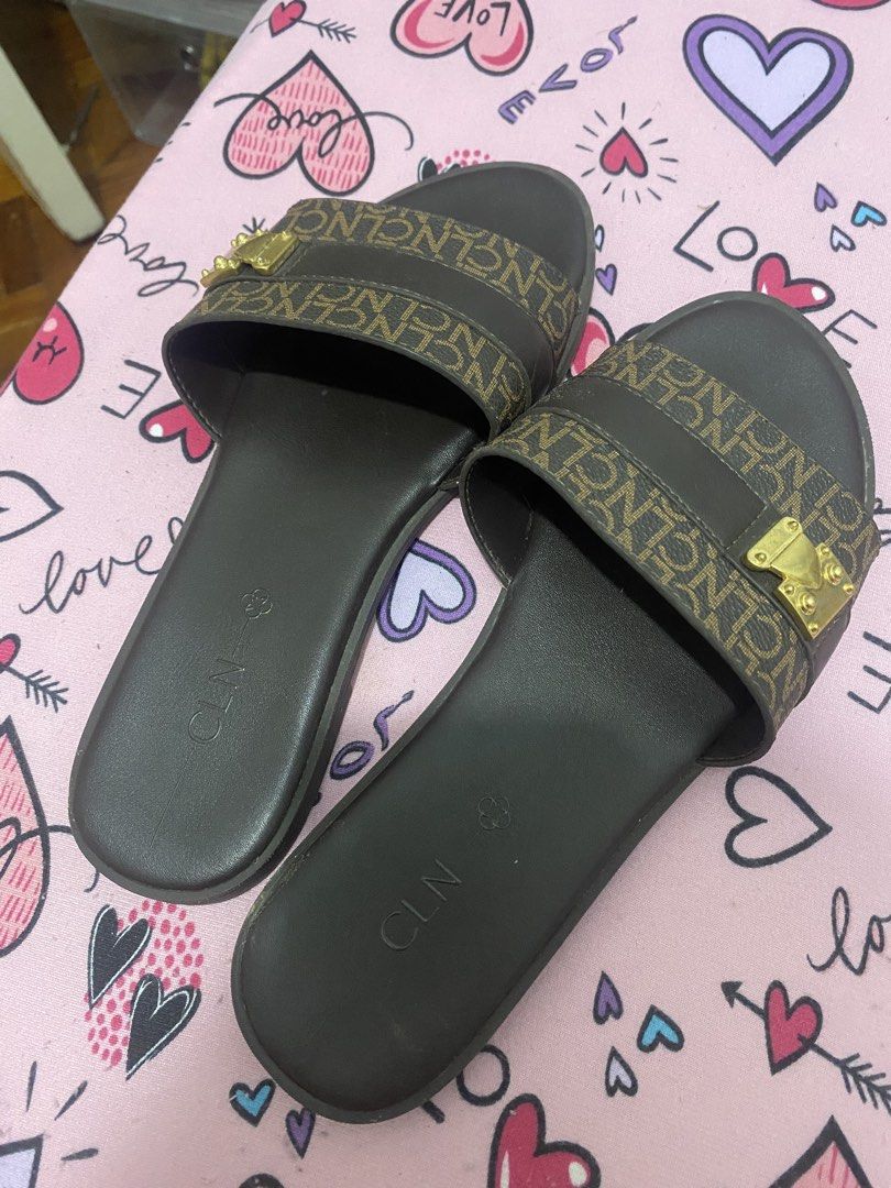 CLN Brown Monogram Slides with Gold Buckle (Category: Flats & Sandals) located in Taguig. Submitted by mumpreloveddd (Listing ID 1448065139, Image 3). Description: - Brand: CLN - Color: Brown - Design: Monogram pattern on strap - Detail: Gold buckle accent - Style: Slip-on - Occasion: Casual wear.