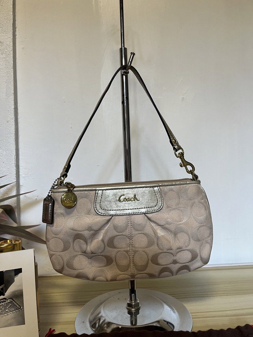 Coach Madison Pink Monogram Shoulder Bag (Category: Luxury Bags & Wallets) located in Quezon. Submitted by consulhann69386 (Listing ID 1447921854, Image 1). Description: - Light pink Coach shoulder bag - Signature monogram pattern - Metallic silver accent with Coach logo on front - Multiple interior pockets - Made in the Philippines - Comes with original Coach dust bag.