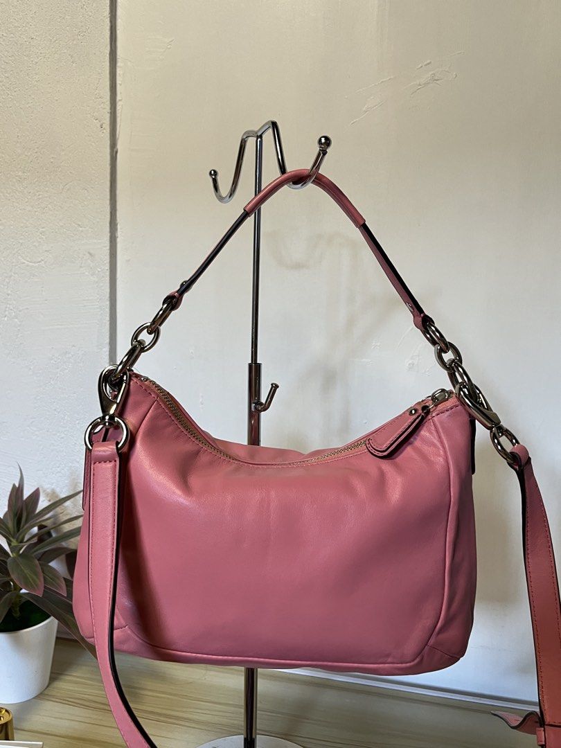 Coach Pink Leather Shoulder Bag with Silver Hardware (Category: Luxury Bags & Wallets) located in Quezon. Submitted by consulhann69386 (Listing ID 1447922560, Image 3). Description: - Authentic Coach pink leather shoulder bag - Features a secure turn-lock closure - Comes with a detachable crossbody strap for versatile wear - Elegant silver hardware details .