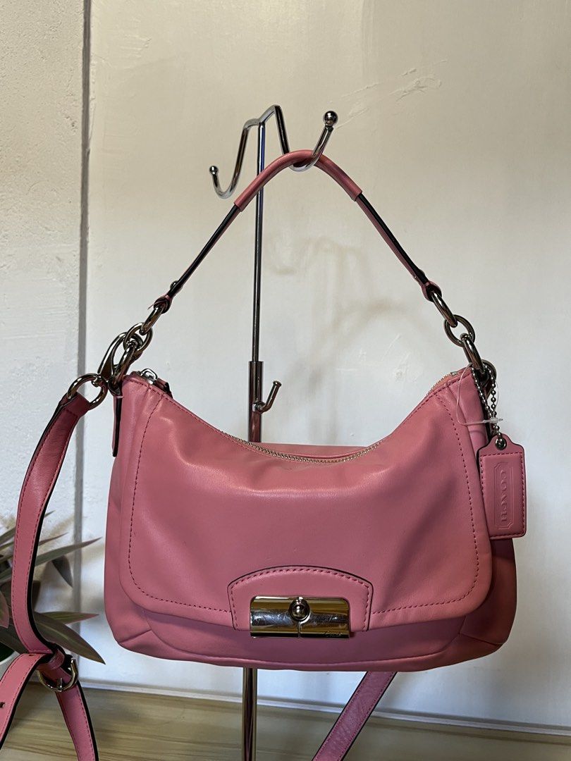 Coach Pink Leather Shoulder Bag with Silver Hardware (Category: Luxury Bags & Wallets) located in Quezon. Submitted by consulhann69386 (Listing ID 1447922560, Image 2). Description: - Authentic Coach pink leather shoulder bag - Features a secure turn-lock closure - Comes with a detachable crossbody strap for versatile wear - Elegant silver hardware details .
