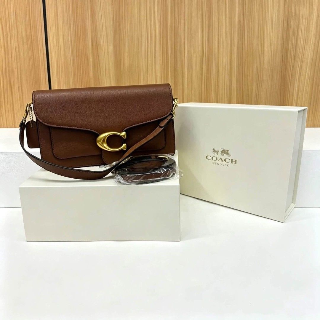 Coach Tabby Shoulder Bag 26 in Brown (Category: Luxury Bags & Wallets) located in Manila. Submitted by luminouseluxe (Listing ID 1447923070, Image 1). Description: - Authentic Brown Coach Tabby Shoulder Bag - Features iconic Coach C hardware - Comes with an adjustable strap - Includes original Coach box - Versatile for everyday or special occasions - Classic Coach New York design.