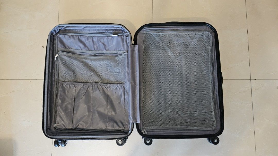 Conwood Black Hardshell Spinner Luggage with Telescopic Handle (Category: Luggage) located in Manila. Submitted by laklp (Listing ID 1447898031, Image 3). Description: - Medium size (24in) - Durable black hardshell spinner luggage - Effortless maneuverability with 4 spinner wheels (1 wheel is cracked, but can be repaired by the buyer) - Convenient telescopic handle - Multiple interior compartments and straps for organization - With expandable zip