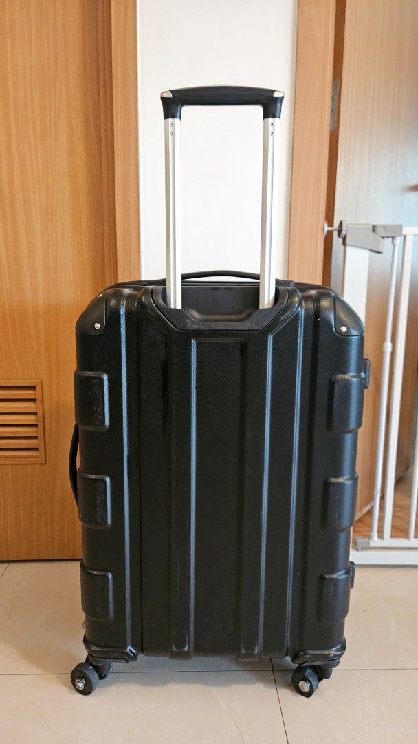 Conwood Black Hardshell Spinner Luggage with Telescopic Handle (Category: Luggage) located in Manila. Submitted by laklp (Listing ID 1447898031, Image 2). Description: - Medium size (24in) - Durable black hardshell spinner luggage - Effortless maneuverability with 4 spinner wheels (1 wheel is cracked, but can be repaired by the buyer) - Convenient telescopic handle - Multiple interior compartments and straps for organization - With expandable zip