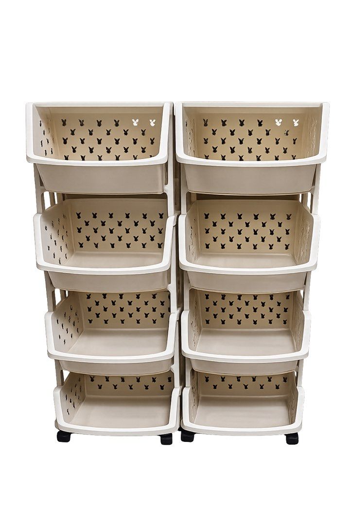 Cream 8 Tier Storage Rack with Bunny Cutouts (Category: Storage Boxes & Baskets) located in Quezon City. Submitted by flowercharm (Listing ID 1448002231, Image 1). Description: - Cream colored 8-tier storage rack - 4 tiers on each side - Adorable bunny cutouts on each tier - Versatile for toys, toiletries, or kitchen organization - Equipped with wheels for easy mobility - Space-saving design, perfect for small areas.