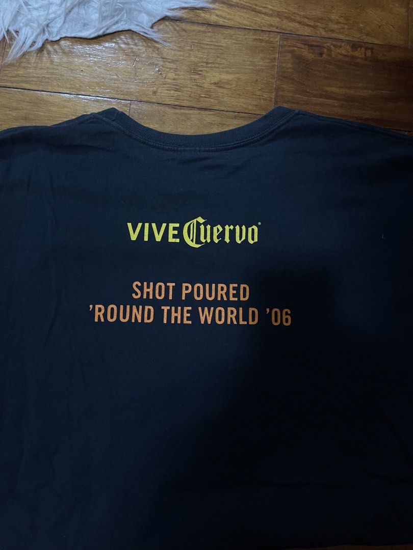 Cuervo Season '06 T-Shirt (Category: Tshirts & Polo Shirts ) located in Cainta. Submitted by FirstBuys (Listing ID 1447995749, Image 3). Description: 23 x 30 - Black t-shirt with 'Cuervo Season' graphic on the front. - Back design: 'VIVE Cuervo' and 'SHOT POURED 'ROUND THE WORLD '06'. - Ideal for fans of the brand. - Great for everyday casual wear..
