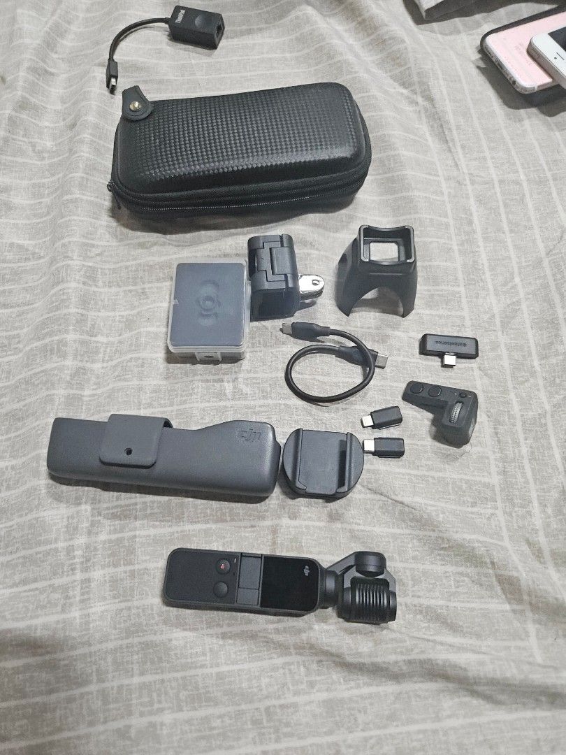 DJI Osmo pocket 1 (Category: Cameras) located in Quezon City. Submitted by margonladio (Listing ID 1447967543, Image 1). Description: - DJI Osmo Pocket camera - Charging cable - Various accessories included - Protective case - Ideal for smooth, portable video recording - All items pictured are included.