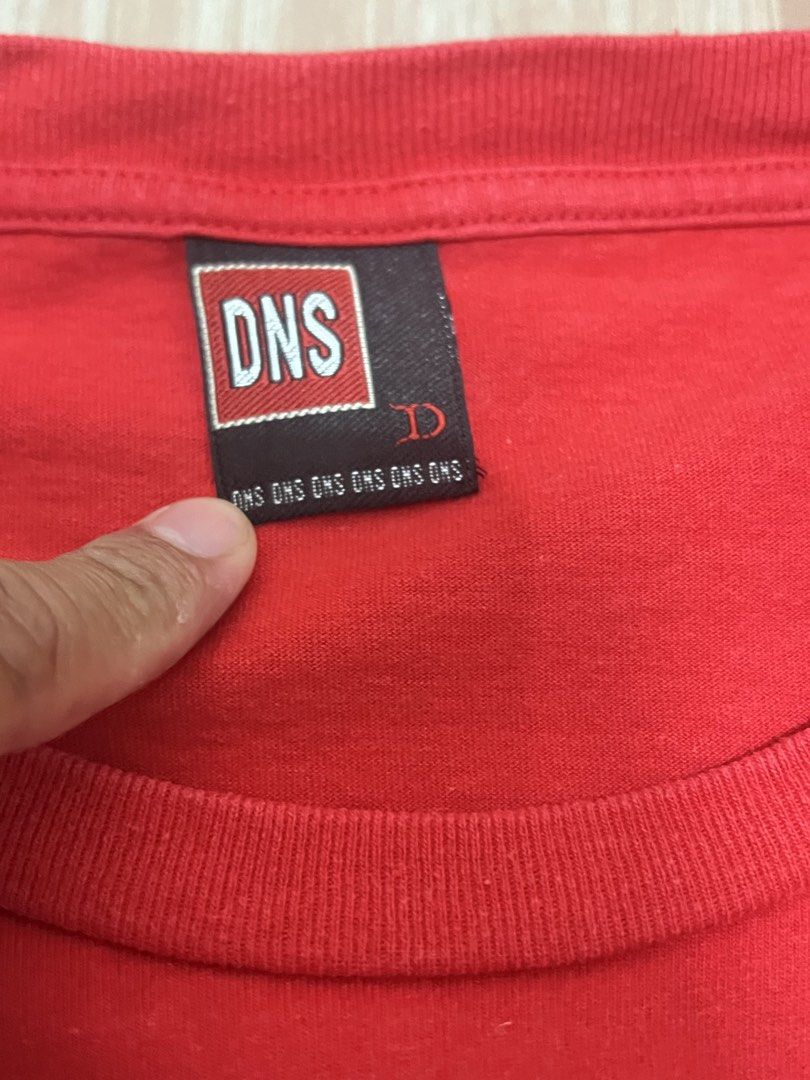 DNS Red T-shirt with Authentic Graphic Print (Category: Tshirts & Polo Shirts ) located in Naga. Submitted by retro_rackph (Listing ID 1448027470, Image 3). Description: - Brand: DNS - Color: Red - Size: L - Design: Graphic print with 'Authentic' text and retro computer/phone graphic - Background detail: Repeated '123 TEST...' text - Ideal for: Casual wear 21x26.
