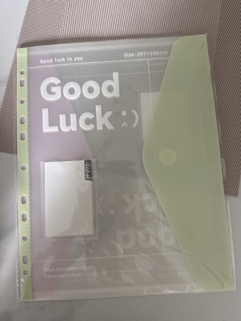 Document Folder (Category: Stationery & School Supplies) located in Singapore. Submitted by emilywlk (Listing ID 1447889813, Image 1). Description: - 'Good Luck' design document folder - Size: 305x240mm - Features a label pocket - Light green, red and blue - Perfect for organizing important papers or as a thoughtful gift.