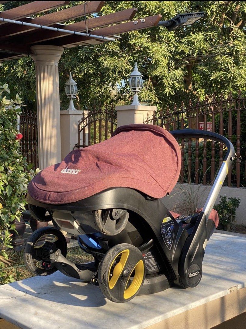 Doona+ Infant Car Seat Stroller - Burgundy (Category: Strollers) located in San Pedro. Submitted by icesyp (Listing ID 1447969867, Image 3). Description: Authentic Doona Infant Car Seat + Stroller for sale. Well-loved and still fully functional with normal signs of usage. Smooth folding/unfolding mechanism and wheels in good working condition. Ideal as a stroller/travel system or backup unit. Details: * Second owner * Manufacturing Date: 16 May 2
