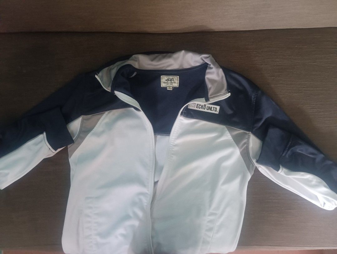 Ecko Unltd. Track Jacket Navy White Grey (Category: Coats, Jackets and Outerwear) located in Cavite. Submitted by o.d2002 (Listing ID 1447945922, Image 1). Description: Ecko Unltd. track jacket Color: Navy blue with white and grey panels - Size L Little issue lng. Natanggal yung zipper head pero kaya naman ibalik. Loc. Alabang, Muntinlupa Pm if interested.