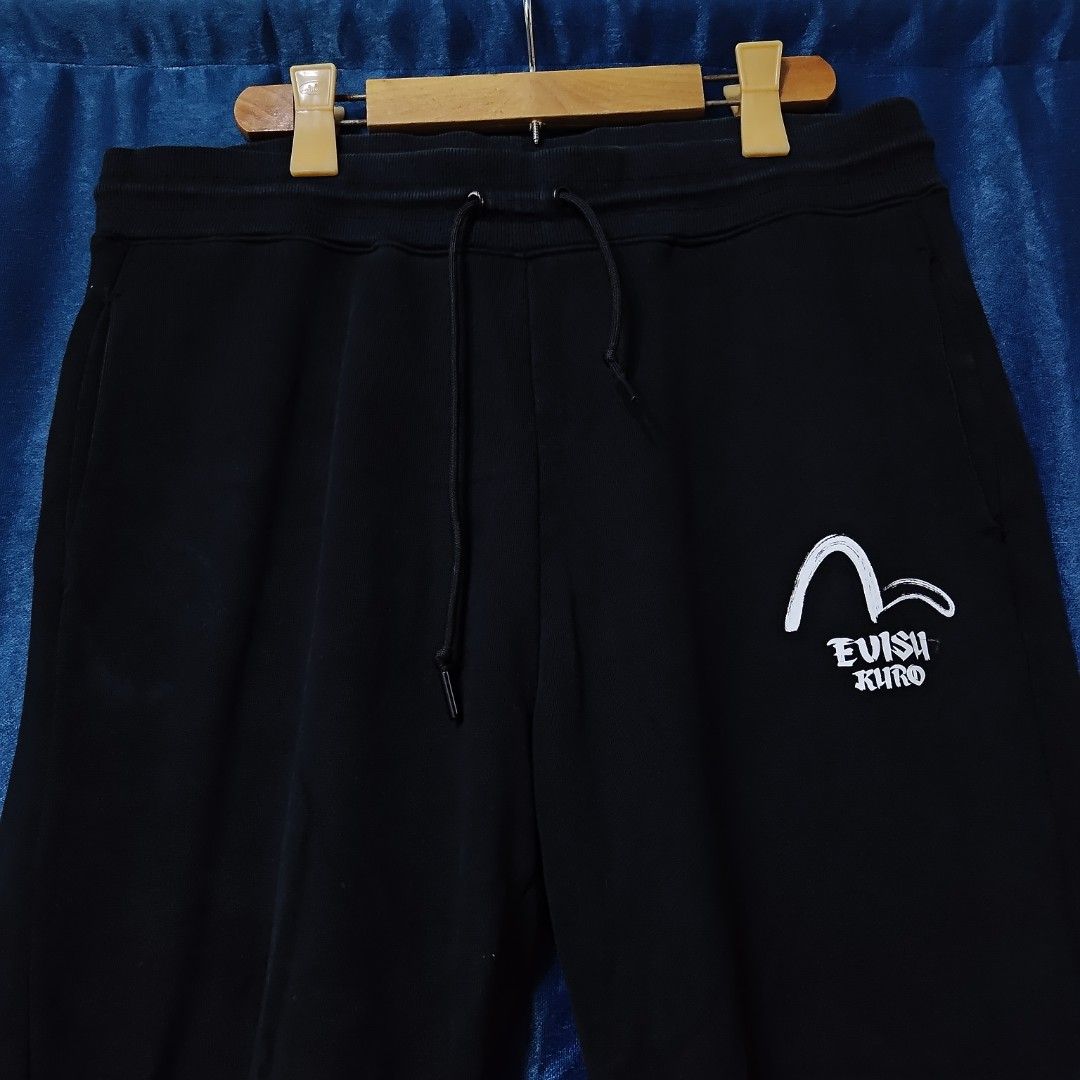 EVISU KURO JOGGER PANTS (Category: Joggers) located in Makati City. Submitted by upcycled.closeth (Listing ID 1448034397, Image 3). Description: - Authentic Evisu kuro product - Black, Jogger pants - Size: Large (men's) - Weistline: 34-36 - length: 40 - Authentic - flaws: No flaws - Excellent condition - Need wash, fresh from bale - Features design of evisu kuro Japan style - Material: 100% Cotton !!STILL NEGOTIABLE!!.