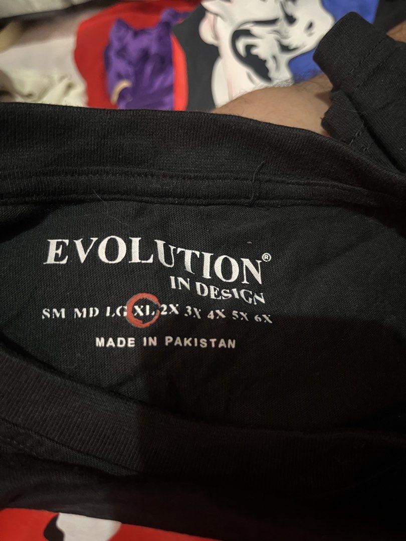 Evolution In Design Black Legacy T-Shirt XL (Category: Tshirts & Polo Shirts ) located in Manila. Submitted by avelinorj.391 (Listing ID 1447936476, Image 2). Description: - Brand: Evolution In Design - Color: Black - Size: XL - Design: Red camouflage 'LEGACY' graphic on front - Material: 100% Cotton - Style: Casual wear - Condition: Please check photos for details.