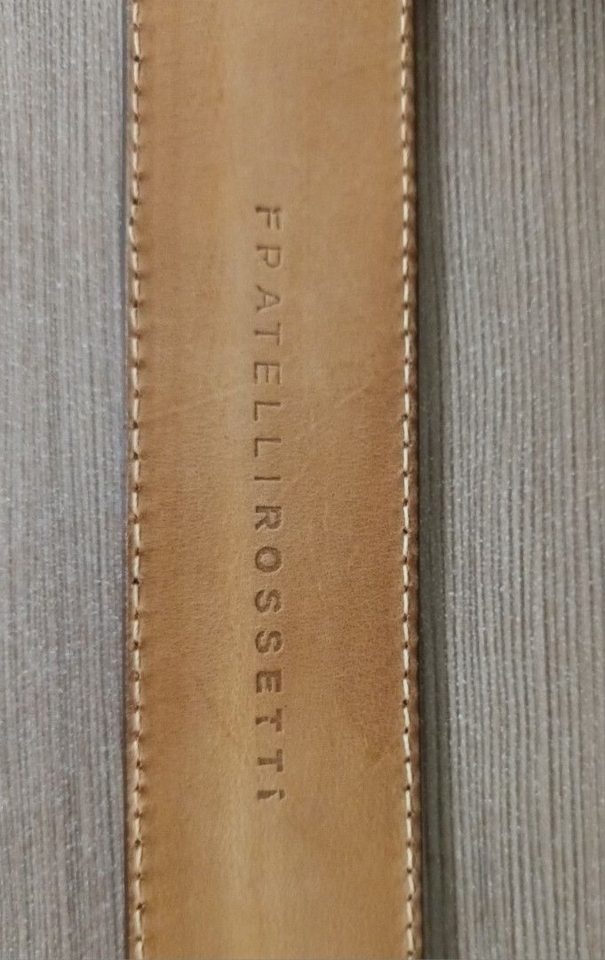 Fratelli Rossetti Leather Belt (Category: Belts) located in Makati City. Submitted by Tins_Haven (Listing ID 1448056158, Image 2). Description: - Brand: Fratelli Rossetti - Color: Classic dark Olive green - Material: Genuine Leather (inside and out) - Buckle: Silver - Features: Contrast stitching along edges - Condition: Shows some signs of use, still in good shape - Versatile: Suitable for everyday wear or dressing up an outfit.