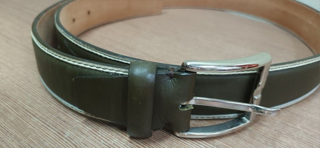 Fratelli Rossetti Leather Belt (Category: Belts) located in Makati City. Submitted by Tins_Haven (Listing ID 1448056158, Image 1). Description: - Brand: Fratelli Rossetti - Color: Classic dark Olive green - Material: Genuine Leather (inside and out) - Buckle: Silver - Features: Contrast stitching along edges - Condition: Shows some signs of use, still in good shape - Versatile: Suitable for everyday wear or dressing up an outfit.