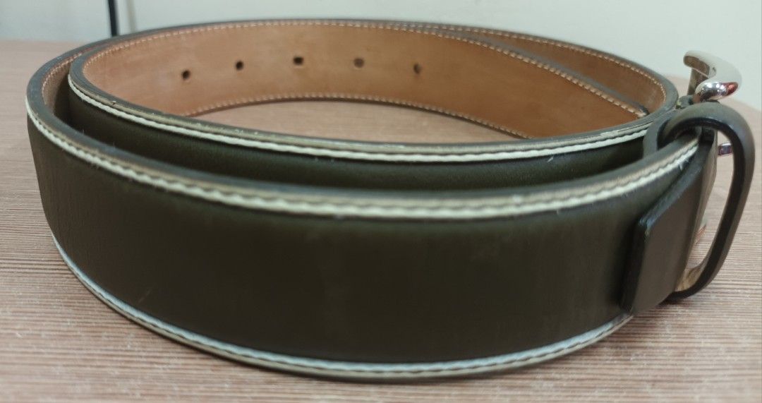 Fratelli Rossetti Leather Belt (Category: Belts) located in Makati City. Submitted by Tins_Haven (Listing ID 1448056158, Image 3). Description: - Brand: Fratelli Rossetti - Color: Classic dark Olive green - Material: Genuine Leather (inside and out) - Buckle: Silver - Features: Contrast stitching along edges - Condition: Shows some signs of use, still in good shape - Versatile: Suitable for everyday wear or dressing up an outfit.